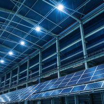 A warehouse equipped with green warehousing technologies, including solar panels and energy efficient lighting systems