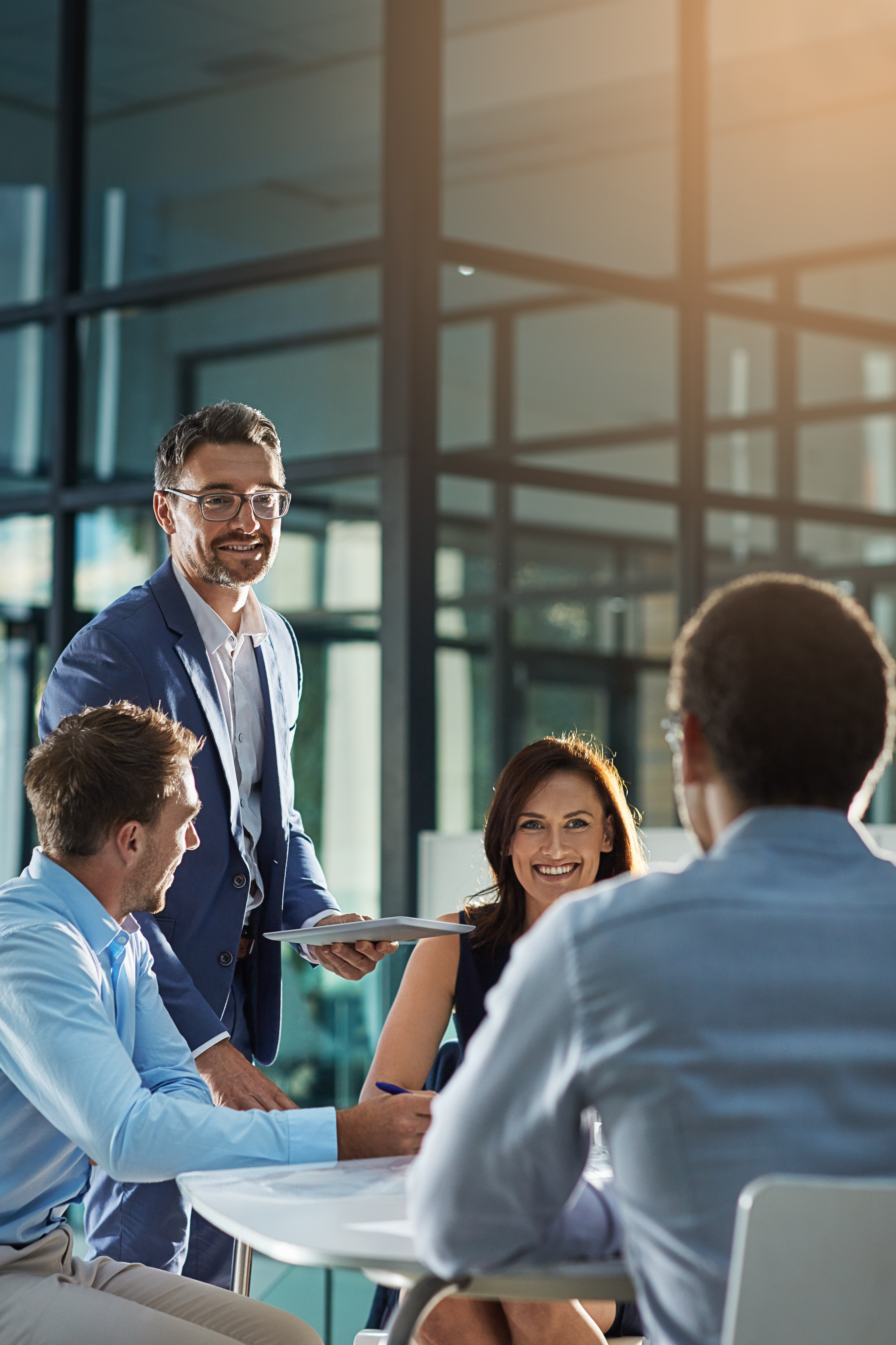 Leader, feedback or business people with tablet for planning, investment research or budget advice. Teamwork, manager and financial advisor in discussion for accounting review, meeting and report